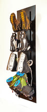 Load image into Gallery viewer, Ski boot dryer mounted in a wall and loaded with ski boots and skates.  For instalation in ski chalet or any mudroom. 
