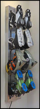 Load image into Gallery viewer, Wall mounted Boot Dryer wall mount. Four pair stainless steel. Warm or ambient air. Attractive space saving design best for ski homes , condos and any mudroom. Timer controlled dryer for ski boots, skates, gloves. Shown with skates, ski boots and xc ski boots. From Puelche dryer
